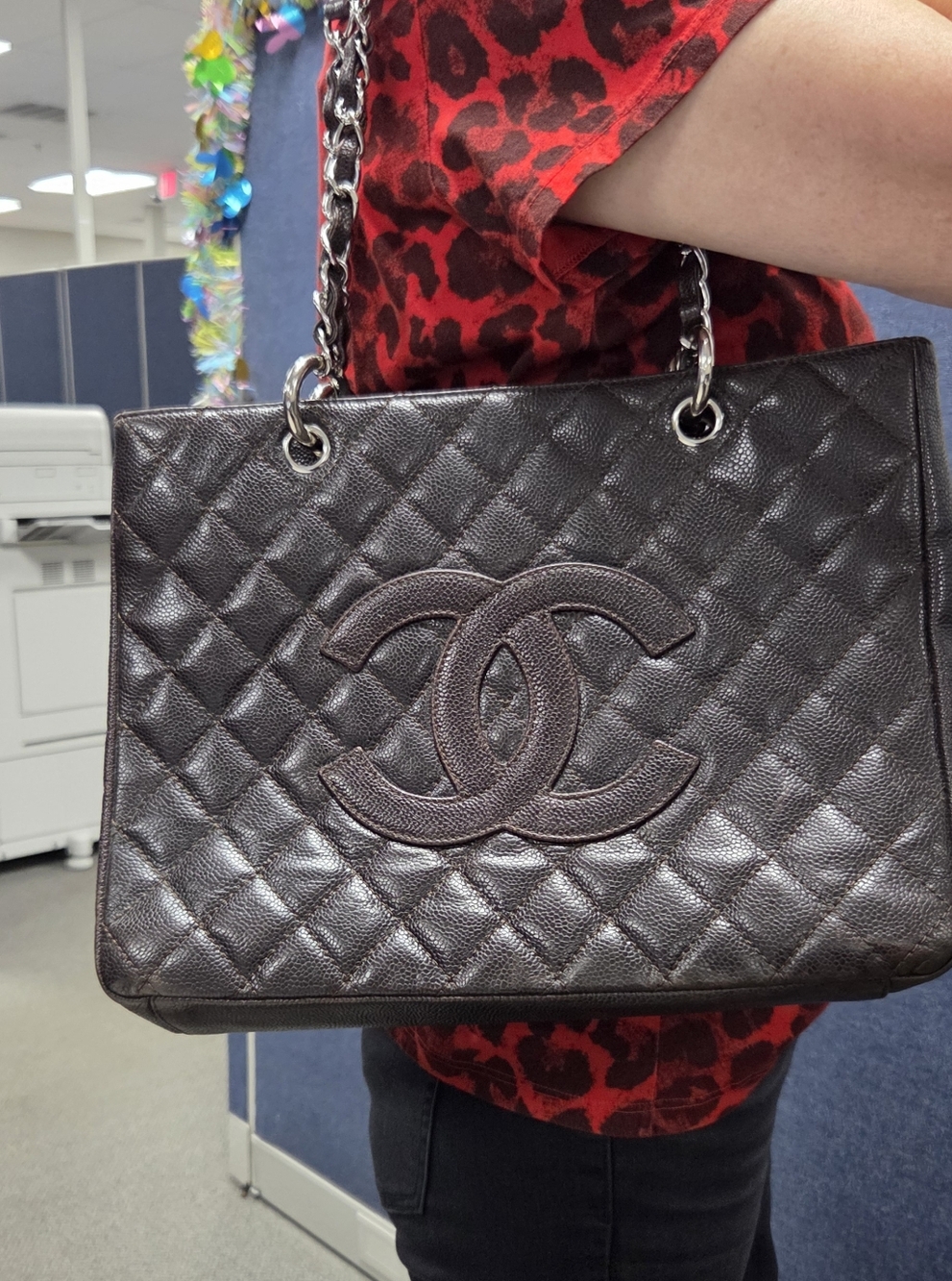 CHANEL Dark Brown GST Quilted Leather Tote with Silver-Tone Chain Handles.